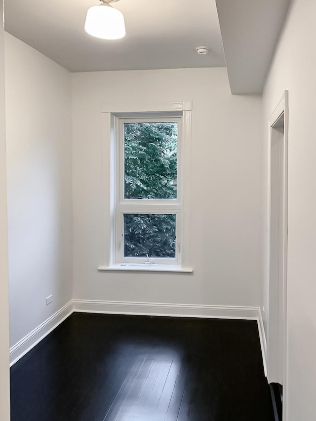 2641 W Thomas St, Chicago, IL 60622 - empty room with a smoke detector and dark wood-style floors