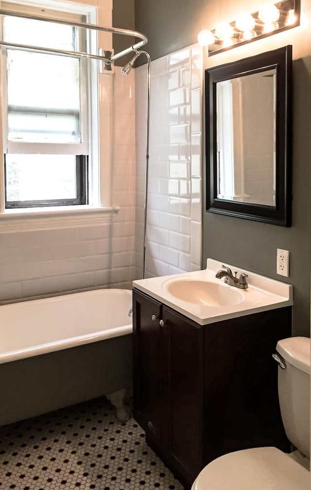 2641 W Thomas St, Chicago, IL 60622 - full bathroom with vanity, healthy amount of natural light, and shower / washtub combination