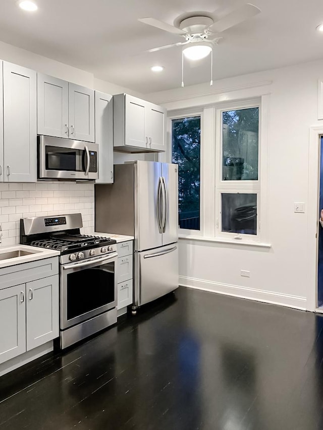 2641 W Thomas St, Chicago, IL 60622 - kitchen featuring stainless steel appliances, ceiling fan, recessed lighting, backsplash, and light countertops