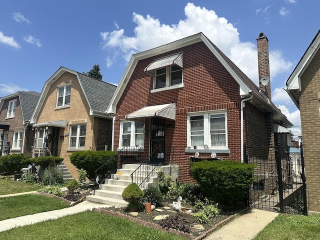 4440 W Iowa St, Chicago, IL 60651 - view of front of house with brick siding, a chimney, and a gate