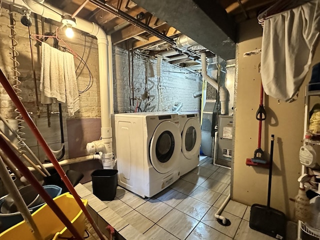 4440 W Iowa St, Chicago, IL 60651 - laundry area featuring separate washer and dryer and tile patterned floors