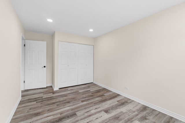 761 Colorado Ct, Carol Stream, IL 60188 - unfurnished bedroom featuring wood finished floors, a closet, and recessed lighting
