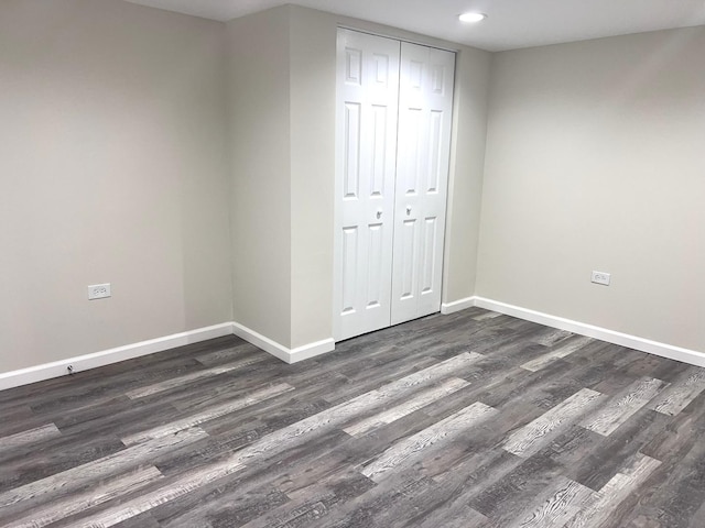 21655 Clyde Ave, Sauk Village, IL 60411 - unfurnished bedroom with dark wood-style flooring, a closet, and recessed lighting