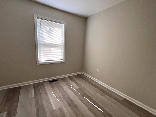 21655 Clyde Ave, Sauk Village, IL 60411 - spare room featuring wood finished floors and baseboards