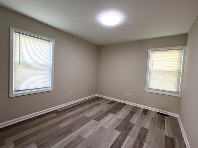 21655 Clyde Ave, Sauk Village, IL 60411 - empty room with dark wood-type flooring and baseboards