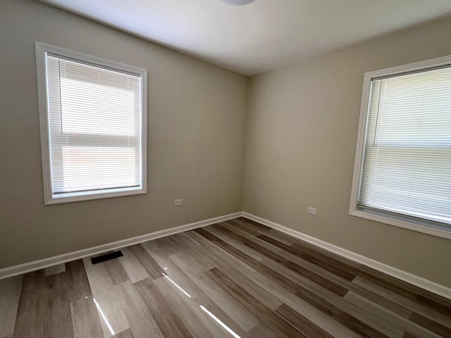 21655 Clyde Ave, Sauk Village, IL 60411 - spare room featuring plenty of natural light and wood finished floors