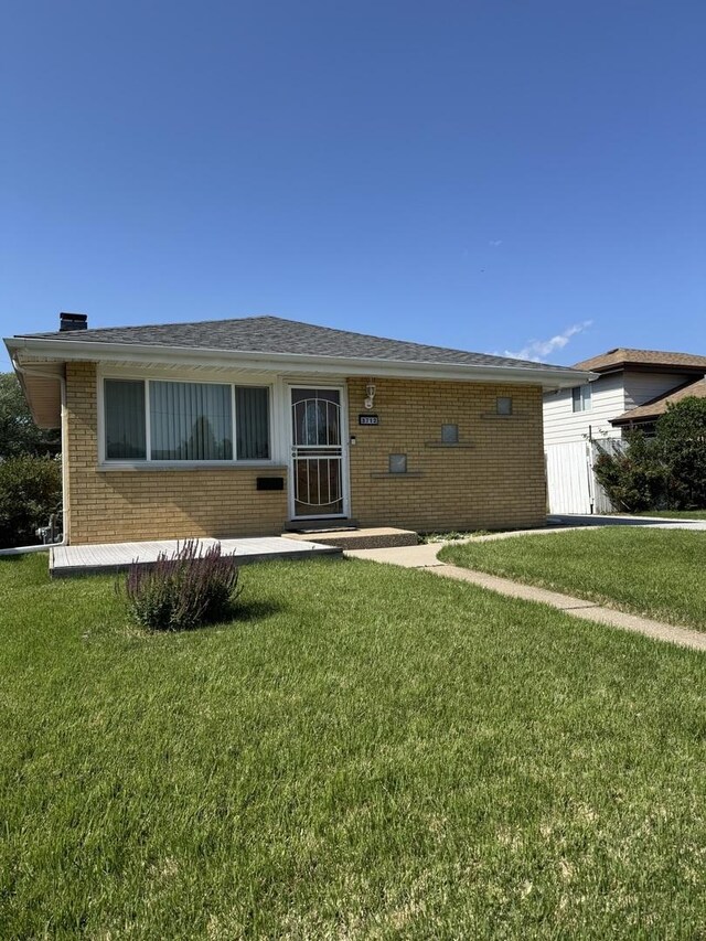3712 W 121st St, Alsip, IL 60803 - view of front of house featuring brick siding and a front yard