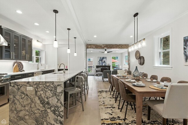 4525 N Artesian Ave, Chicago, IL 60625 - dining area with light wood finished floors, recessed lighting, ceiling fan, and ornamental molding