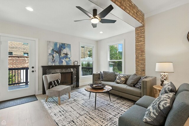 4525 N Artesian Ave, Chicago, IL 60625 - living room featuring a high end fireplace, wood finished floors, a ceiling fan, and recessed lighting