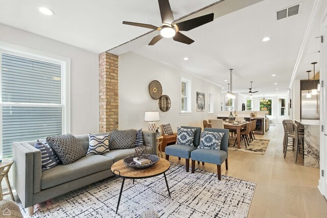 4525 N Artesian Ave, Chicago, IL 60625 - living room featuring ceiling fan, light wood-style floors, crown molding, and recessed lighting