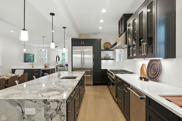 4525 N Artesian Ave, Chicago, IL 60625 - kitchen with premium appliances, under cabinet range hood, light wood-style flooring, light stone countertops, and open shelves
