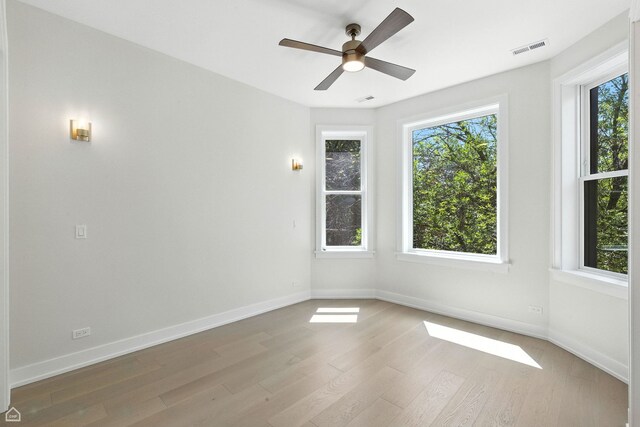 4525 N Artesian Ave, Chicago, IL 60625 - unfurnished room with light wood-style floors and a ceiling fan