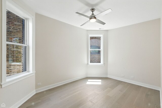 4525 N Artesian Ave, Chicago, IL 60625 - empty room with light wood-type flooring and ceiling fan