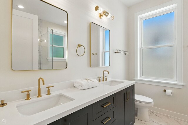 4525 N Artesian Ave, Chicago, IL 60625 - full bathroom with marble finish flooring, plenty of natural light, double vanity, and a shower