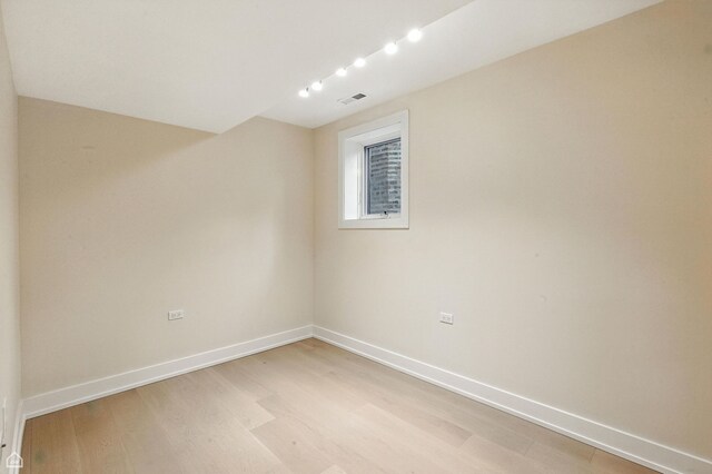 4525 N Artesian Ave, Chicago, IL 60625 - unfurnished room with light wood finished floors and baseboards