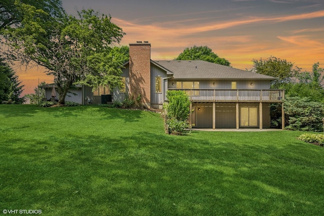 10 N Highview Cir, Hawthorn Woods, IL 60047 - back of house featuring a wooden deck, a chimney, a lawn, and a shingled roof