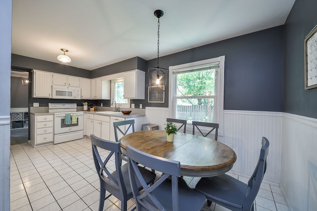 1605 Rita Ave, Saint Charles, IL 60174 - dining room with wainscoting and light tile patterned floors