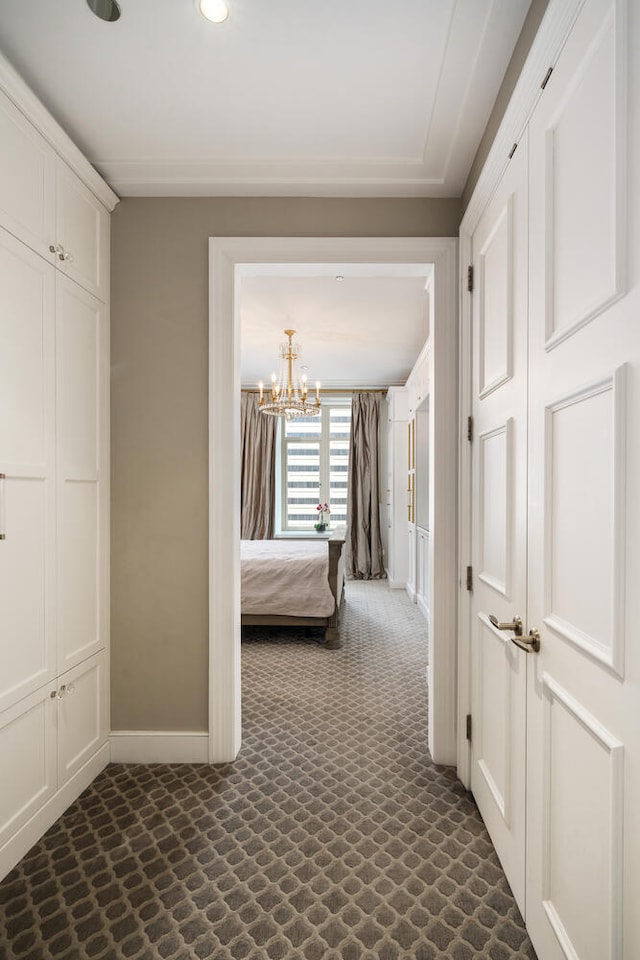 118 E Erie St Unit 21C, Chicago, IL 60611 - bedroom featuring a chandelier and baseboards