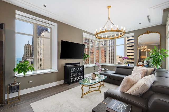 118 E Erie St Unit 21C, Chicago, IL 60611 - living room featuring a chandelier, plenty of natural light, wood finished floors, and ornamental molding