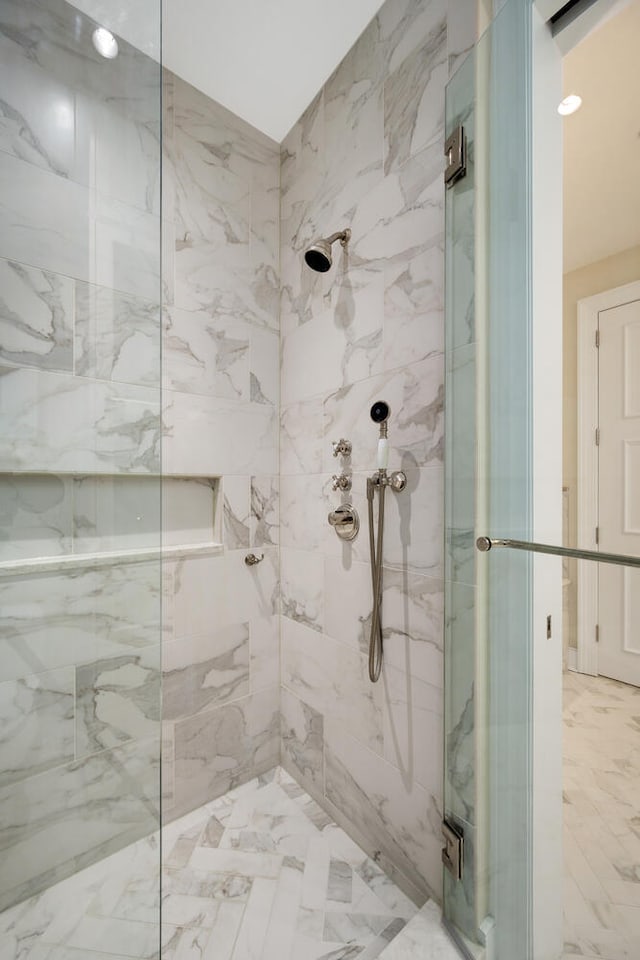 118 E Erie St Unit 21C, Chicago, IL 60611 - bathroom featuring a marble finish shower and marble finish floors