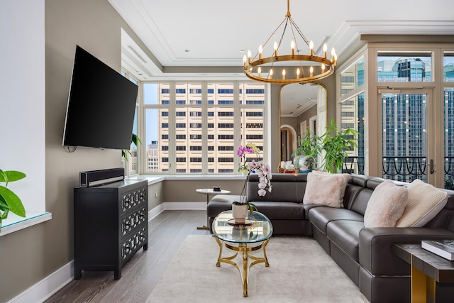 118 E Erie St Unit 21C, Chicago, IL 60611 - living area featuring ornamental molding, wood finished floors, a chandelier, and arched walkways