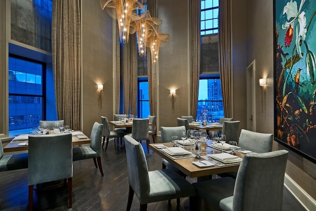 118 E Erie St Unit 21C, Chicago, IL 60611 - dining space with a high ceiling, hardwood / wood-style floors, and a chandelier