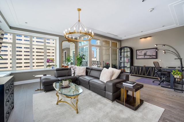 118 E Erie St Unit 21C, Chicago, IL 60611 - living area featuring wood finished floors, a chandelier, crown molding, arched walkways, and a desk