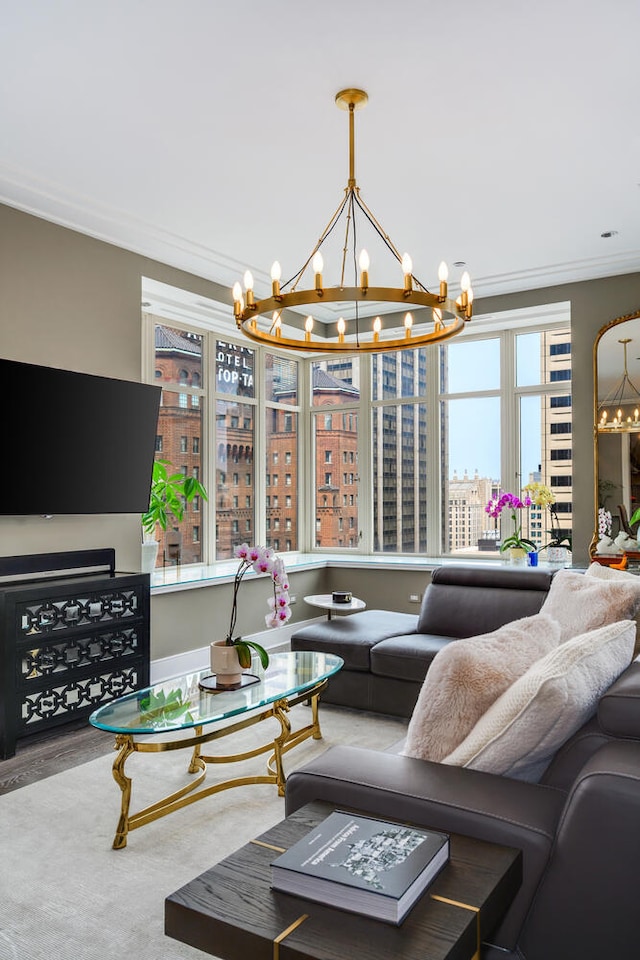 118 E Erie St Unit 21C, Chicago, IL 60611 - living room with a chandelier, a city view, crown molding, and wood finished floors