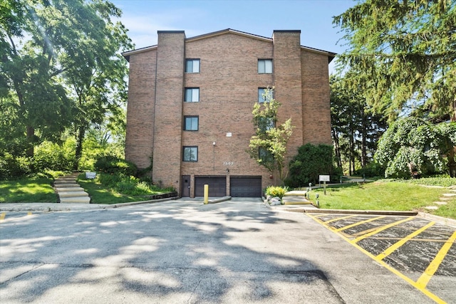 7502 Farmingdale Dr Unit 408, Darien, IL 60561 - view of property with a garage