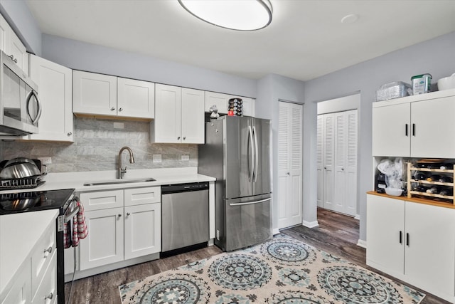 7502 Farmingdale Dr Unit 408, Darien, IL 60561 - kitchen featuring stainless steel appliances, light countertops, decorative backsplash, and wood finished floors