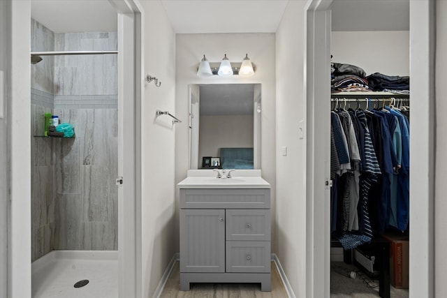 7502 Farmingdale Dr Unit 408, Darien, IL 60561 - bathroom featuring a shower stall, vanity, and a spacious closet