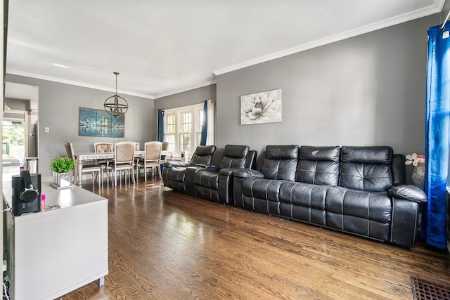 8112 Christie Ave, Lyons, IL 60534 - living area featuring wood finished floors, healthy amount of natural light, a chandelier, and ornamental molding