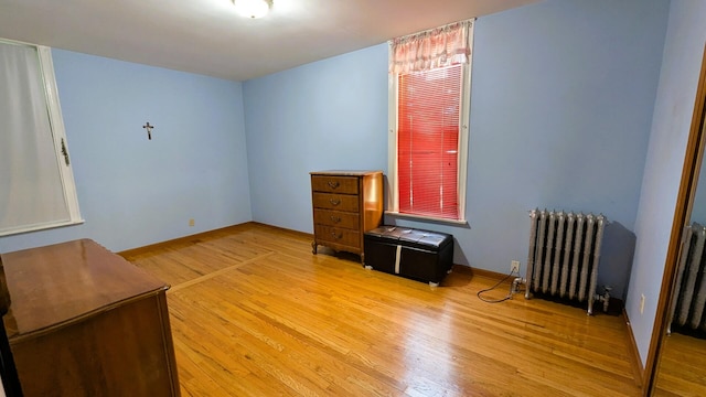 6240 S Kolmar Ave, Chicago, IL 60629 - unfurnished room featuring radiator heating unit and light wood-style flooring