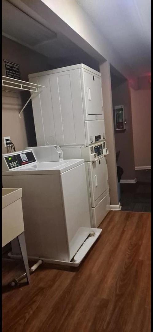 2086 Country Club Dr Unit 3F, Woodridge, IL 60517 - communal laundry room featuring stacked washing machine and dryer, dark wood-type flooring, and separate washer and dryer