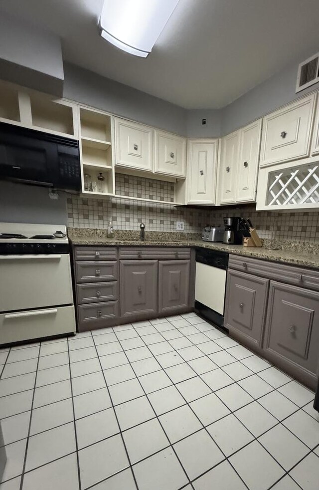 5901 N Sheridan Rd Unit 9G, Chicago, IL 60660 - kitchen featuring white appliances, backsplash, gray cabinetry, and open shelves
