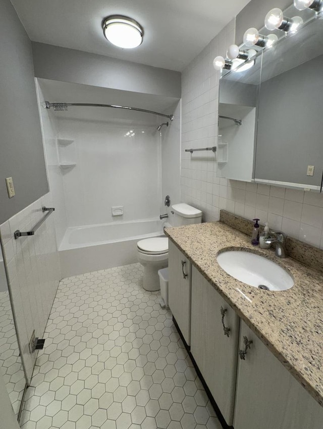 5901 N Sheridan Rd Unit 9G, Chicago, IL 60660 - full bathroom featuring vanity,  shower combination, tile patterned flooring, and decorative backsplash