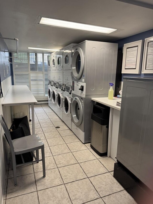 5901 N Sheridan Rd Unit 9G, Chicago, IL 60660 - community laundry with estacked washer and dryer, light tile patterned flooring, and separate washer and dryer