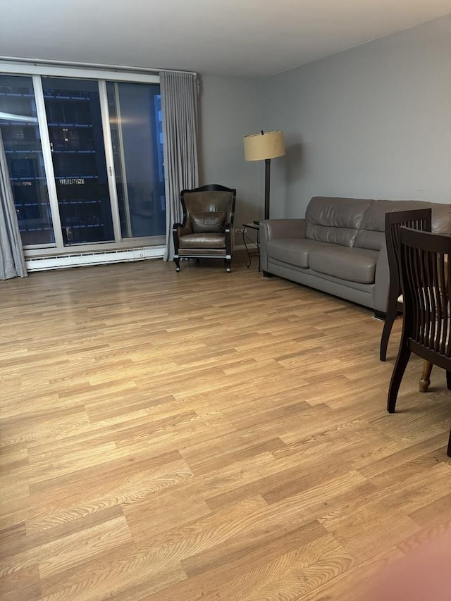 5901 N Sheridan Rd Unit 9G, Chicago, IL 60660 - living area featuring wood finished floors and a baseboard radiator