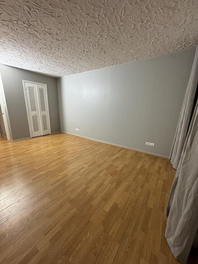 5901 N Sheridan Rd Unit 9G, Chicago, IL 60660 - spare room featuring wood finished floors