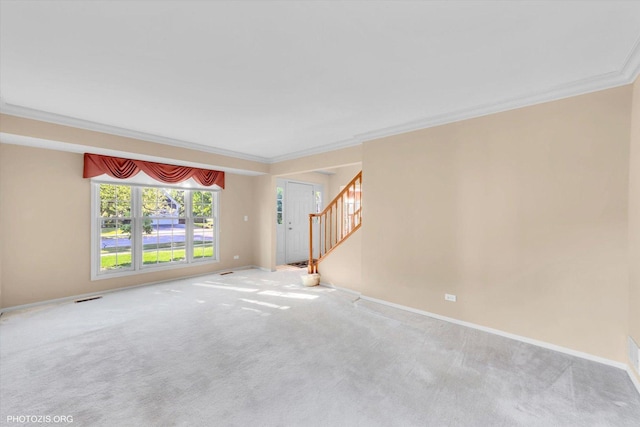 1175 Oxford Ct, Lake Zurich, IL 60047 - unfurnished living room with ornamental molding, stairs, and carpet