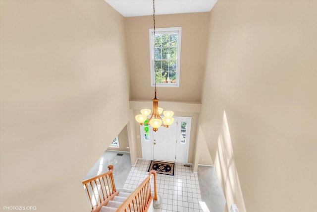 1175 Oxford Ct, Lake Zurich, IL 60047 - foyer featuring a chandelier, tile patterned flooring, and a high ceiling