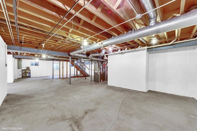 1175 Oxford Ct, Lake Zurich, IL 60047 - unfinished below grade area featuring electric panel, stairs, and heating unit