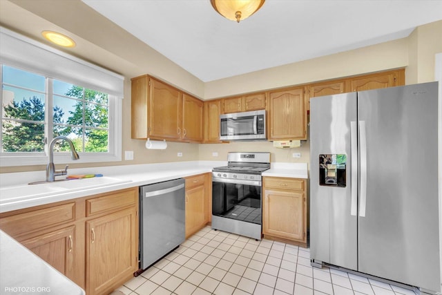 1175 Oxford Ct, Lake Zurich, IL 60047 - kitchen featuring appliances with stainless steel finishes, light countertops, light tile patterned floors, and light brown cabinetry