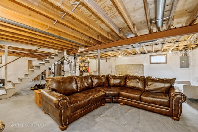 11607 Frederick Way, Huntley, IL 60142 - living area featuring concrete floors, electric panel, and stairway