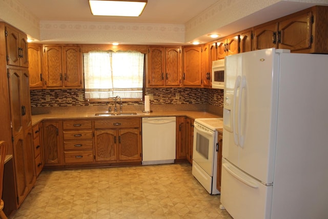 28 Manorhill Dr, Clinton, IL 61727 - kitchen featuring white appliances, brown cabinets, light floors, light countertops, and decorative backsplash