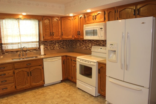 28 Manorhill Dr, Clinton, IL 61727 - kitchen featuring white appliances, brown cabinets, light floors, light countertops, and decorative backsplash