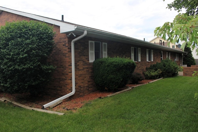 28 Manorhill Dr, Clinton, IL 61727 - view of property exterior with a yard and brick siding