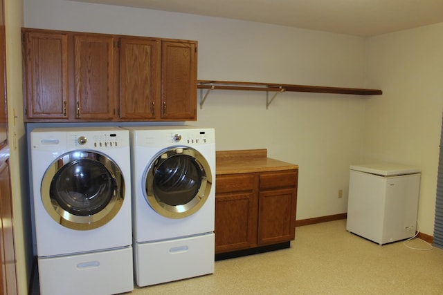 28 Manorhill Dr, Clinton, IL 61727 - laundry room featuring washing machine and clothes dryer and cabinet space