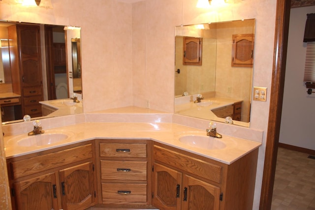 28 Manorhill Dr, Clinton, IL 61727 - full bathroom featuring double vanity and baseboards