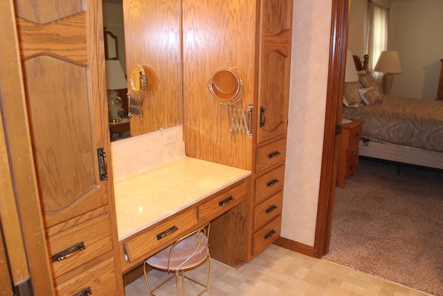 28 Manorhill Dr, Clinton, IL 61727 - bathroom featuring tile patterned floors, vanity, and ensuite bathroom